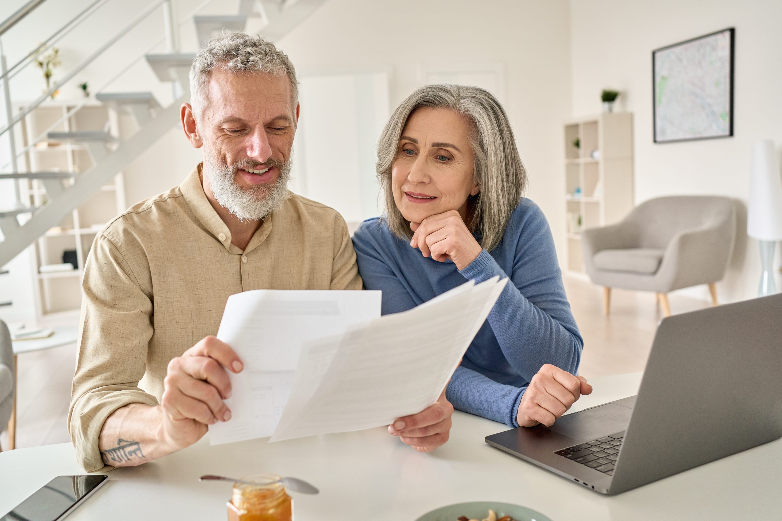 older couple reading Medicare paperwork together